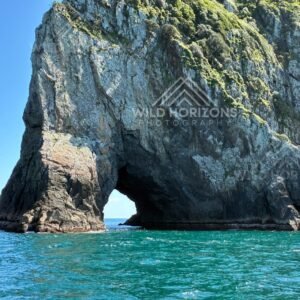 Sheer Cliffs Framing the Hole in the Rock. Bay of Islands, New Zealand