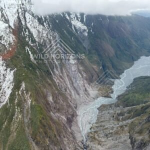 Glacier-Carved Cliffs and Meltwater Valley, Franz Josef Glacier, New Zealand.