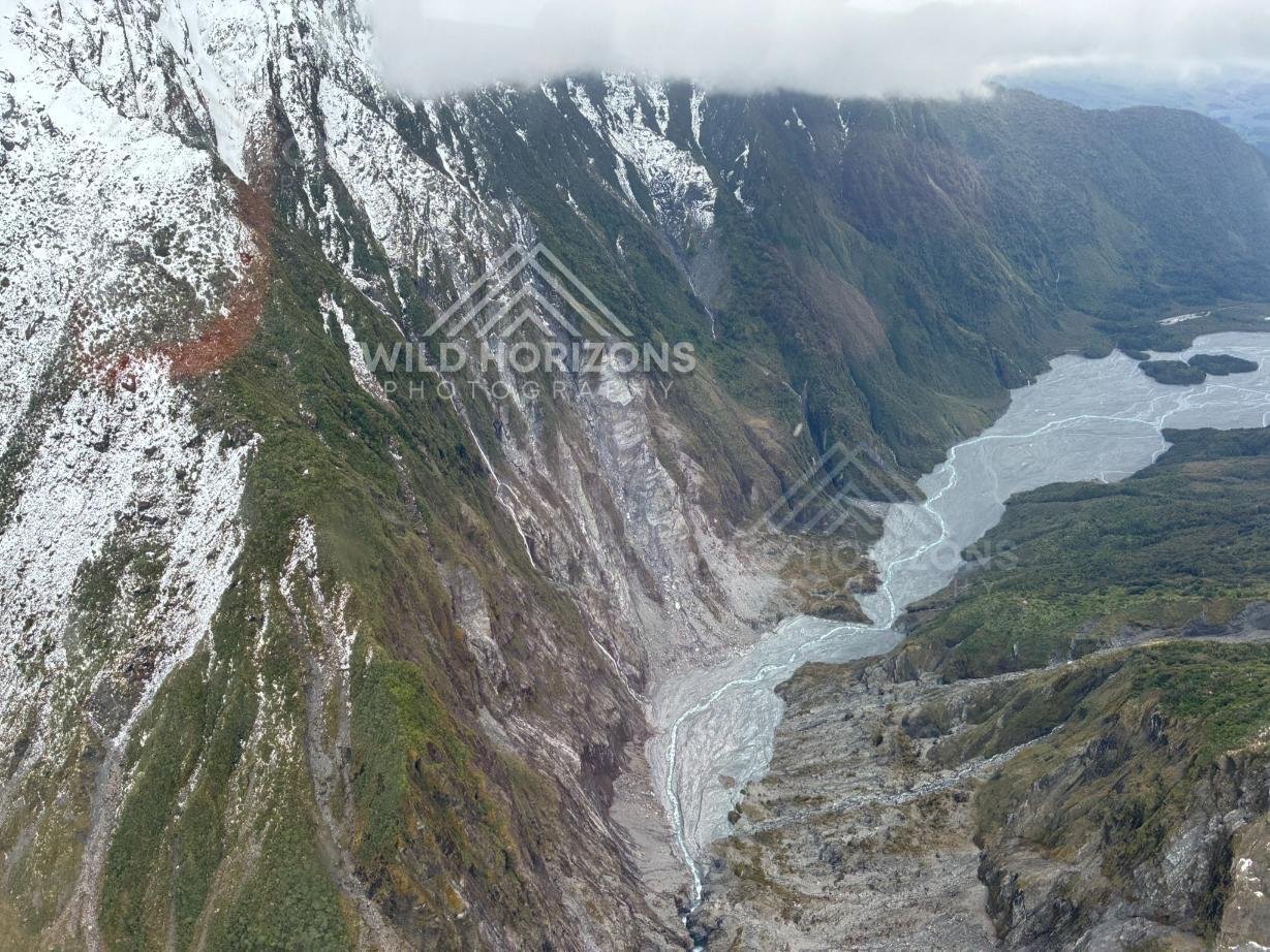 Glacier-Carved Cliffs and Meltwater Valley, Franz Josef Glacier, New Zealand.