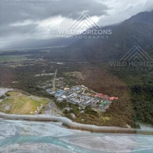 Aerial view of Franz Josef town beside braided river channels. Franz Josef, New Zealand