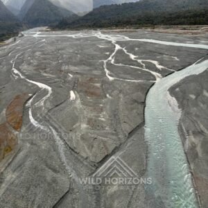 Braided glacial river carving wide alpine gravel flats. Franz Josef, New Zealand