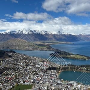 Panoramic view over Queenstown and surrounding alpine lake landscape. Queenstown, New Zealand