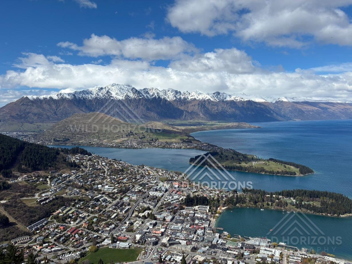 Panoramic view over Queenstown and surrounding alpine lake landscape. Queenstown, New Zealand