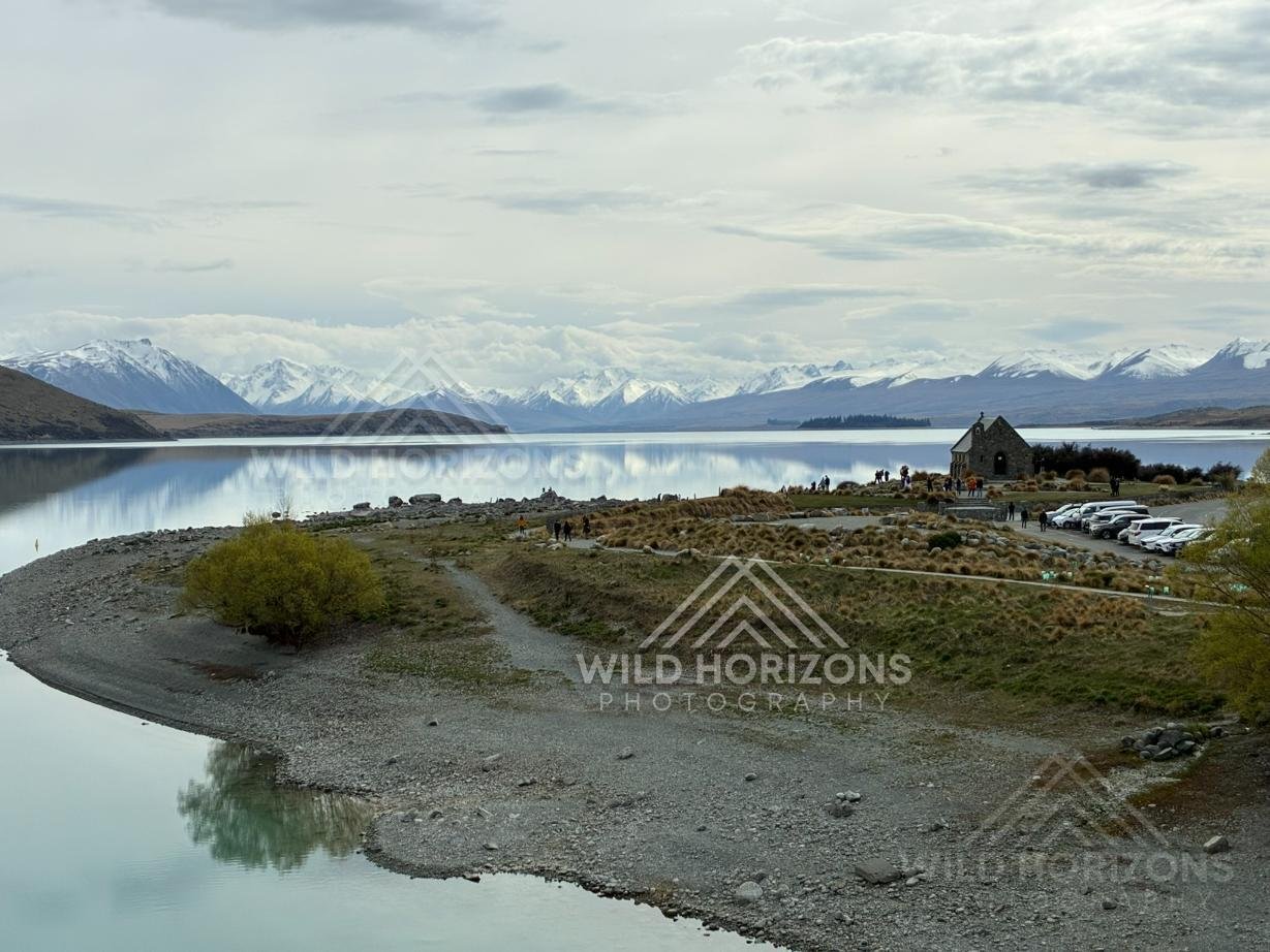 Church of the Good Shepherd overlooking a reflective alpine lake. Lake Tekapo, New Zealand