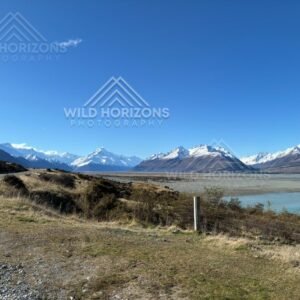 Wide Alpine Basin and Snow-Capped Peaks beside Lake Pukaki. Mount Cook Village, New Zealand
