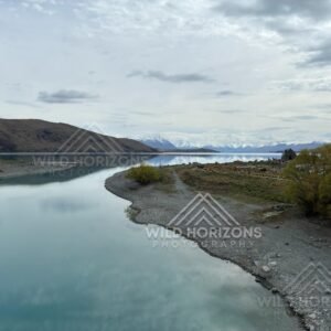 Curving Shoreline and Still Waters beside the Church of the Good Shepherd. Lake Tekapo, New Zealand
