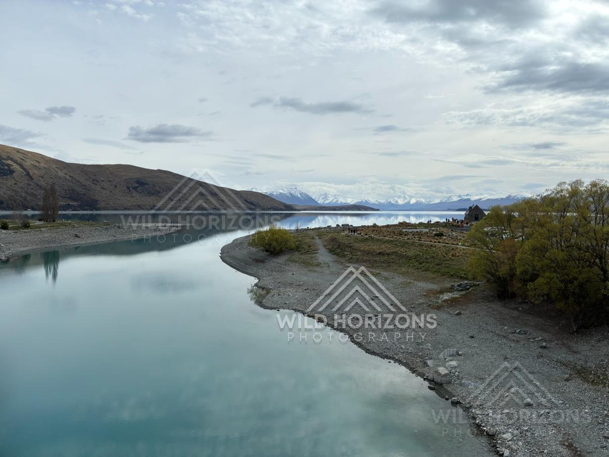 Curving Shoreline and Still Waters beside the Church of the Good Shepherd. Lake Tekapo, New Zealand