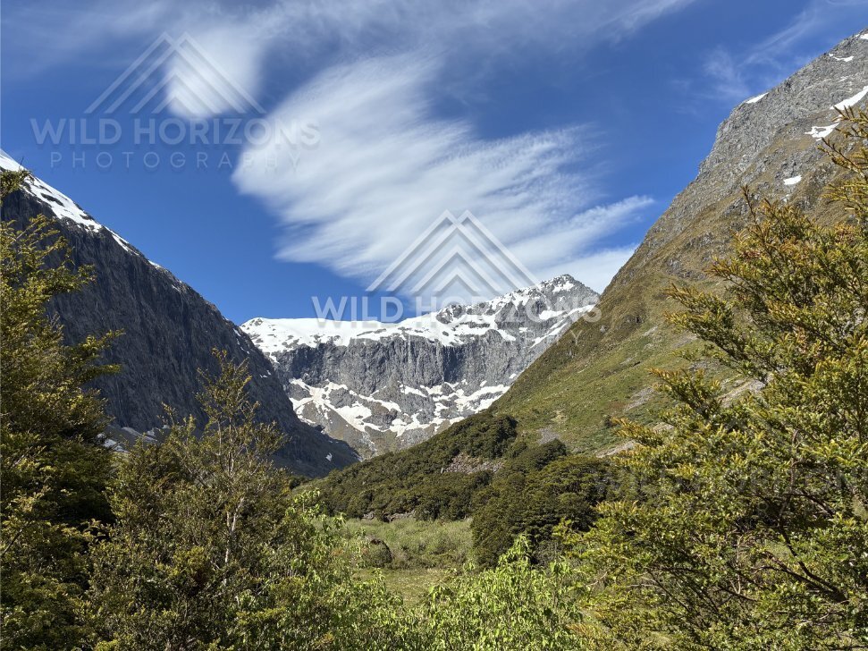 Mountain Valley and Snow-Capped Peaks on Milford Road New Zealand