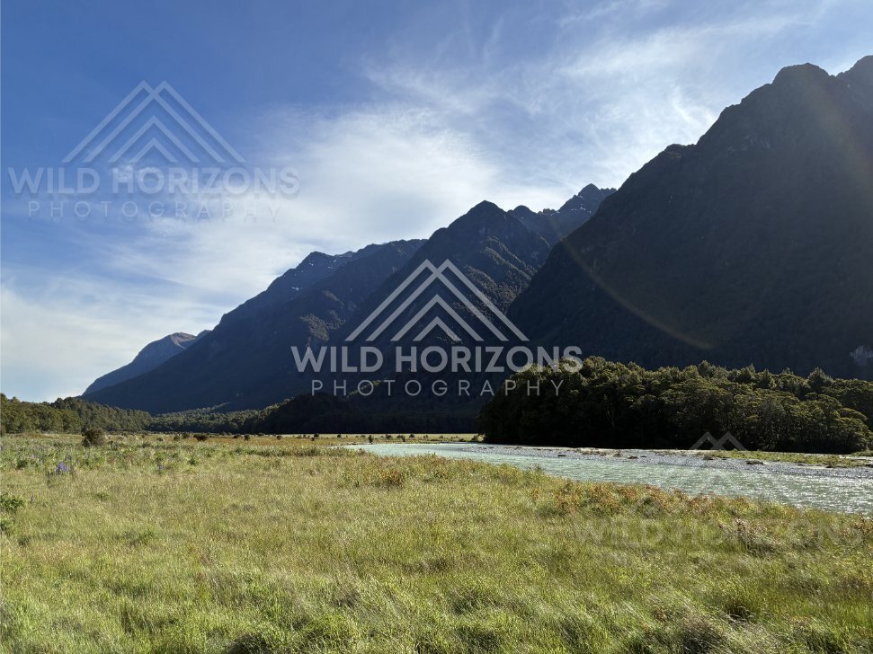 Fiordland River Flat With Dark Mountain Silhouettes, Milford Road, New Zealand