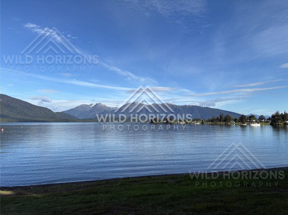 Lake Te Anau Shoreline With Distant Ranges and Marina, Lake Te Anau, New Zealand