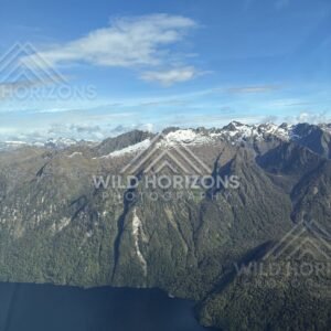 Snow-Edged Mountain Ridge Above Fiordland Lake, Fiordland, New Zealand