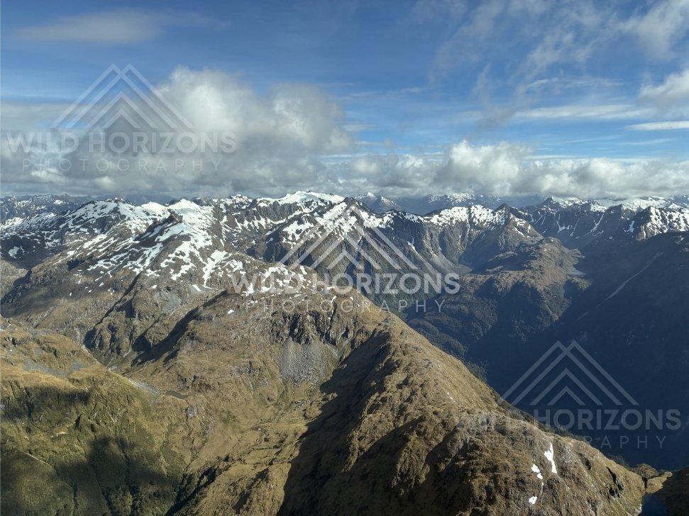 Wide Aerial View of Fiordland Alpine Ranges With Patchy Snow, Fiordland National Park, New Zealand