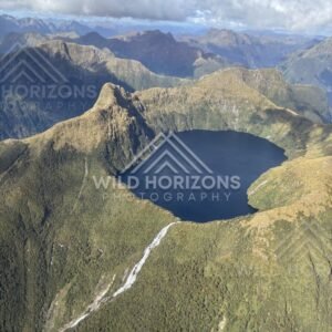 Aerial View of a Circular Mountain Lake and Stream, Fiordland National Park, New Zealand