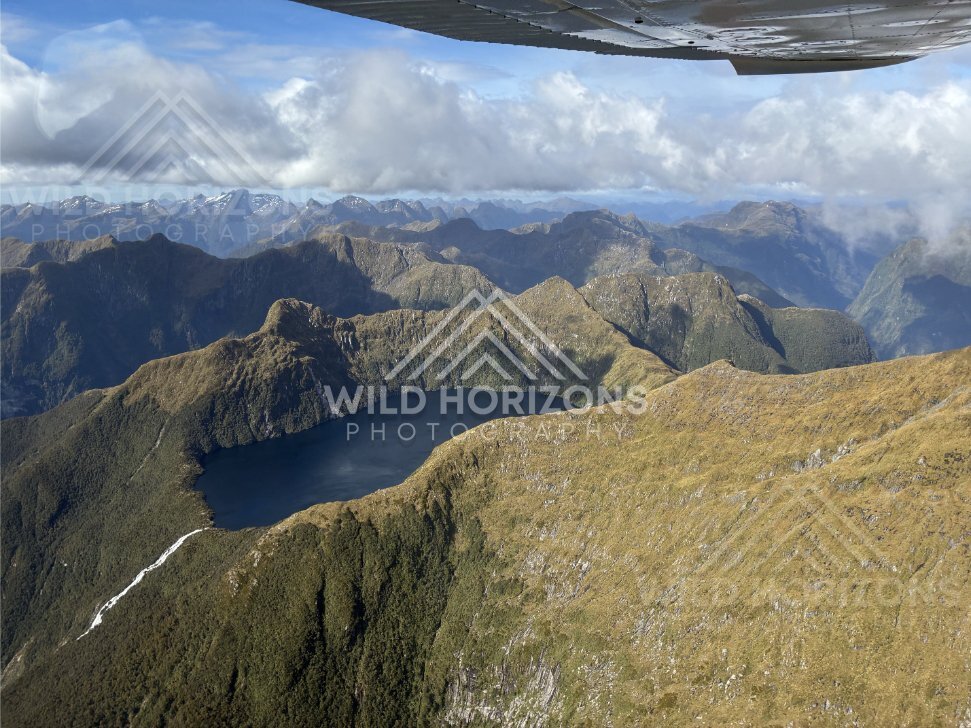 Seaplane View Over a Fiordland Basin Lake and Mountain Ridges, Fiordland National Park, New Zealand