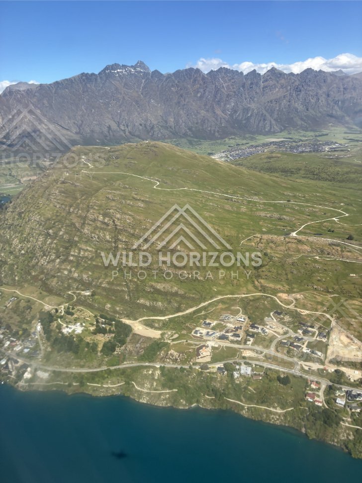 Aerial view over Lake Wakatipu with Queenstown township below. Queenstown and Lake Wakatipu, New Zealand