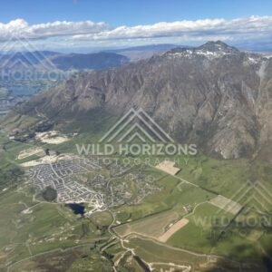 Aerial view over the Queenstown basin and surrounding alpine foothills. Queenstown, New Zealand