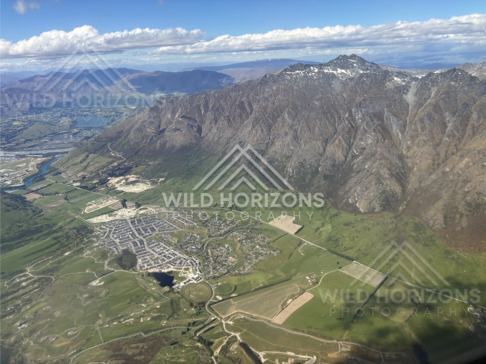 Aerial view over the Queenstown basin and surrounding alpine foothills. Queenstown, New Zealand