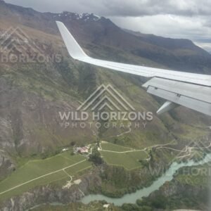 Aerial view of the turquoise Kawarau River winding through steep gorge walls. Kawarau Gorge, New Zealand