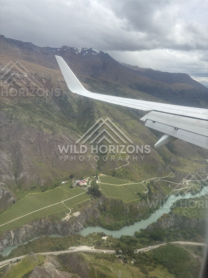 Aerial view of the turquoise Kawarau River winding through steep gorge walls. Kawarau Gorge, New Zealand