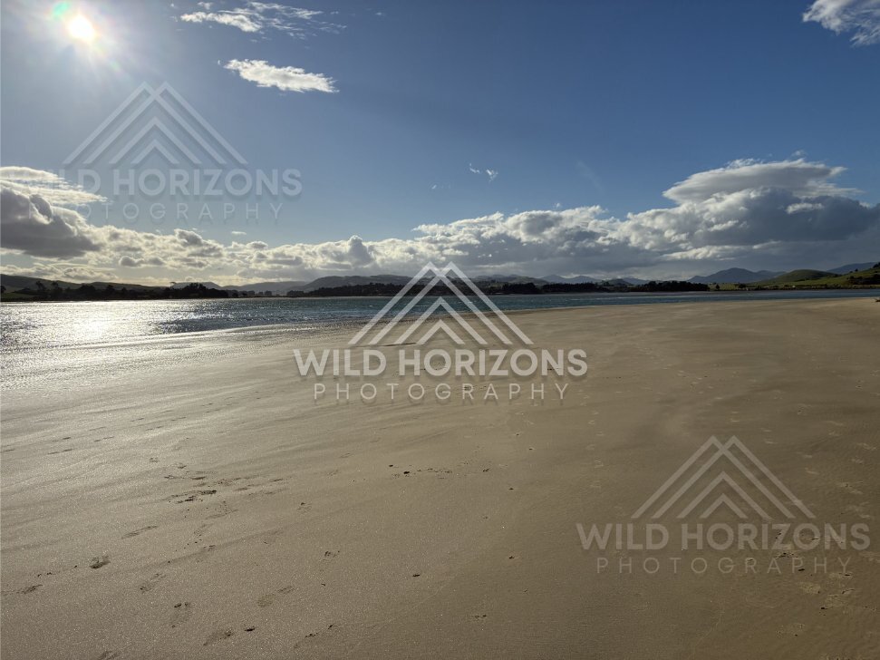 Empty Beach With Sun Glare on Wet Sand, Surat Bay, New Zealand