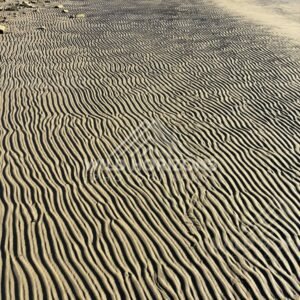 Rippled Beach Sand Beside Rocky Seawall, Surat Bay, New Zealand