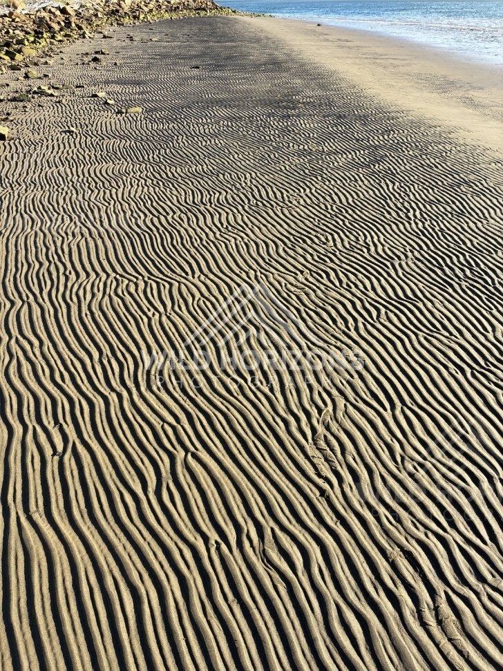Rippled Beach Sand Beside Rocky Seawall, Surat Bay, New Zealand