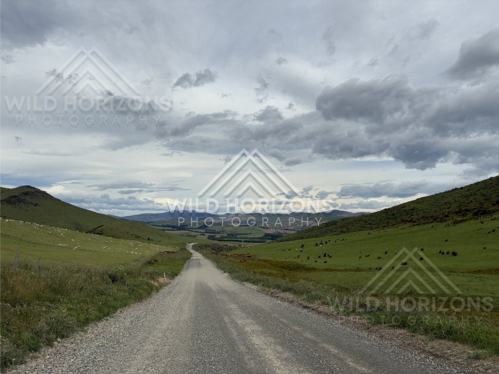 Empty Gravel Road Under Low Cloud Toward Te Anau, New Zealand