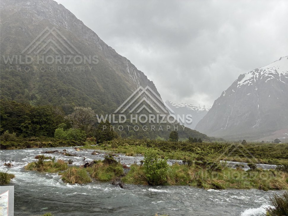 Braided river flats between Fiordland mountains on Milford Road, New Zealand