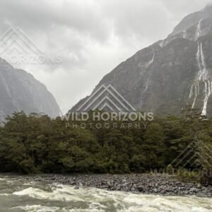 Fiordland valley and waterfalls in stormy weather, Milford Road, New Zealand