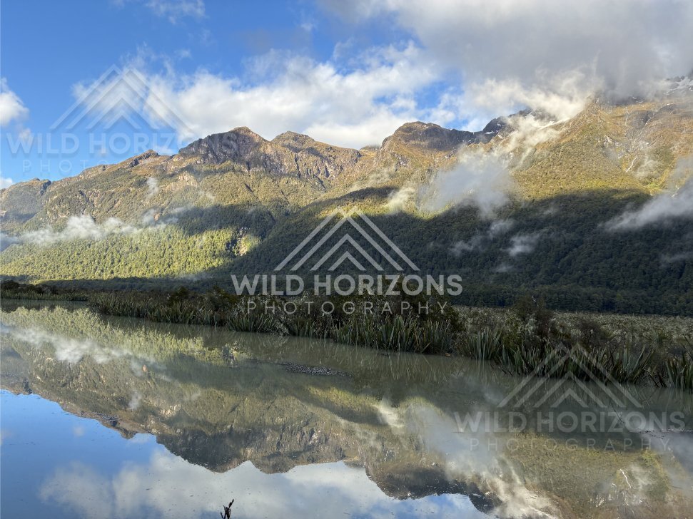 Sunlit Slopes Reflected in Mirror Lakes, Milford Road, New Zealand