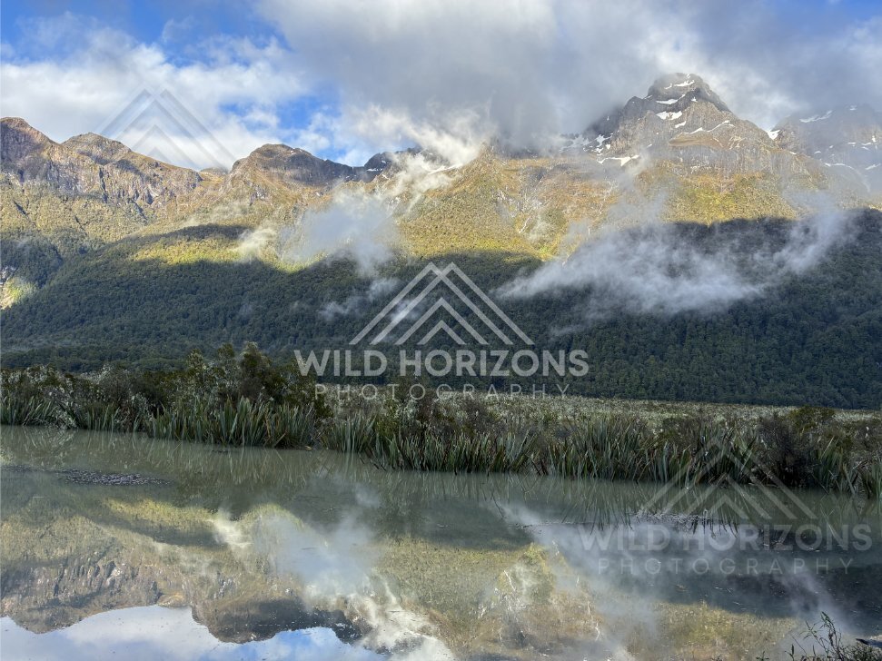 Cloud Banks Rolling Over Peaks Above Mirror Lakes, Milford Road, New Zealand