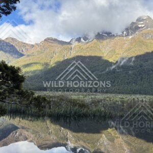 Mirror Lakes Reflection Under Sunlit Peaks, Milford Road, New Zealand