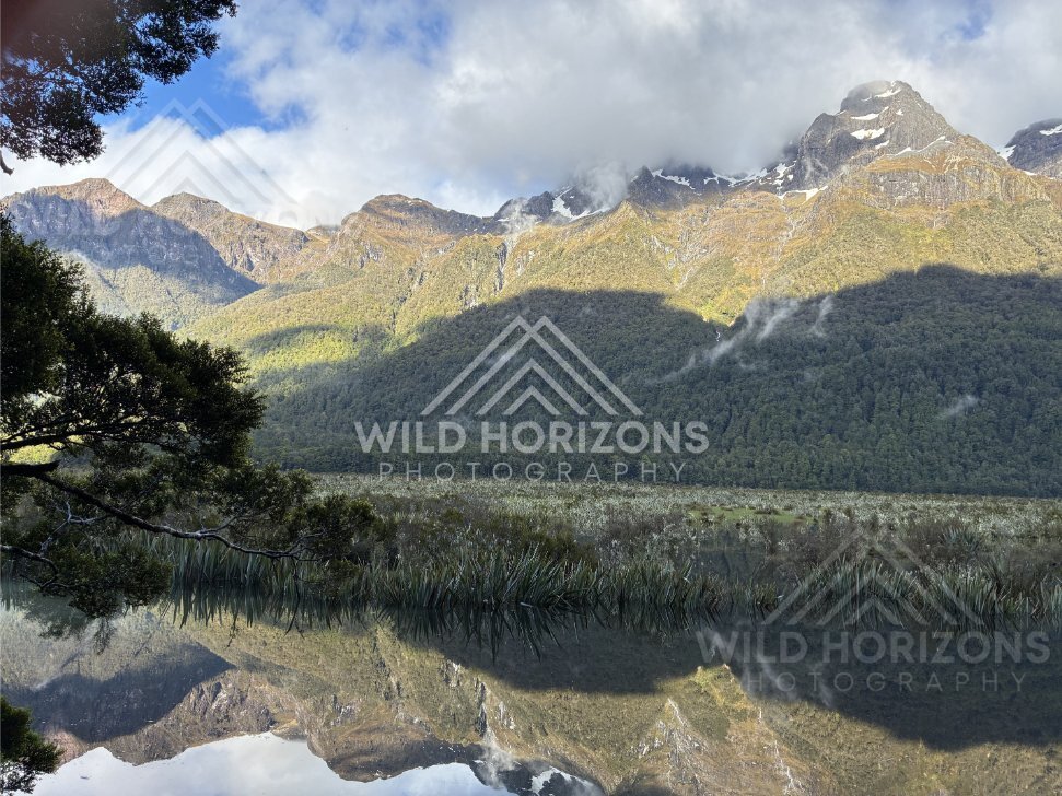 Mirror Lakes Reflection Under Sunlit Peaks, Milford Road, New Zealand