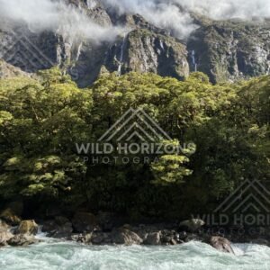 Light and shadow across a remote alpine valley, Milford Road, New Zealand