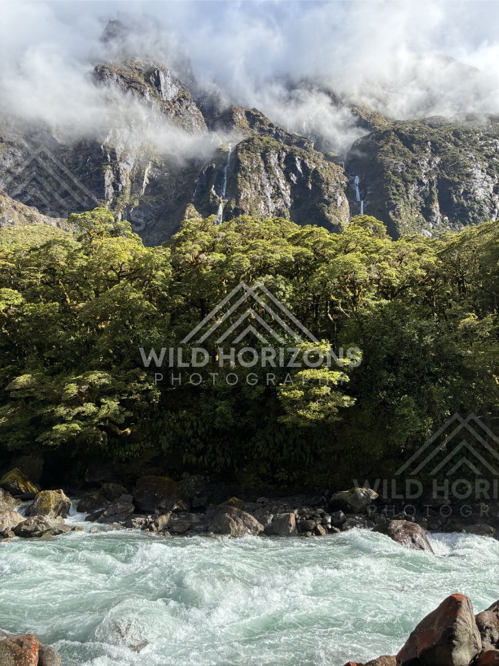 Light and shadow across a remote alpine valley, Milford Road, New Zealand