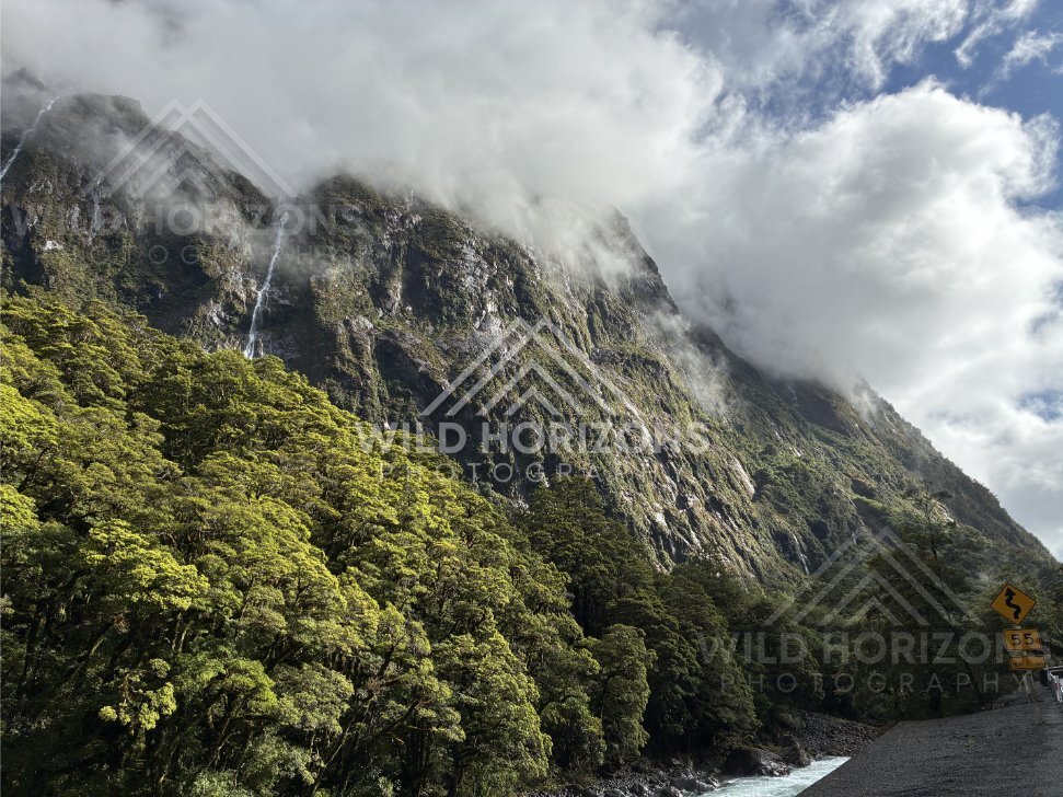 Expansive mountain valley under textured cloud, Milford Road, New Zealand