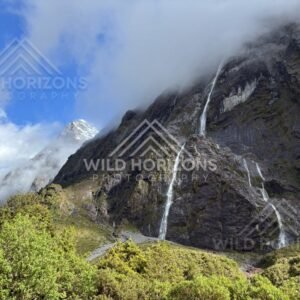 Fiordland Cliff Waterfalls with Mist and Snow Peak, Milford Road, Fiordland National Park, New Zealand