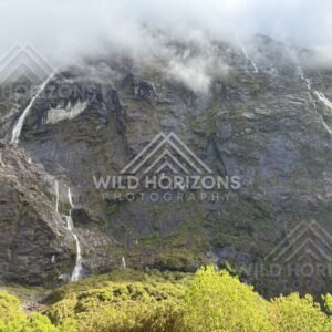 Multiple Waterfalls on a Sheer Fiordland Mountainside, Milford Road, Fiordland National Park, New Zealand