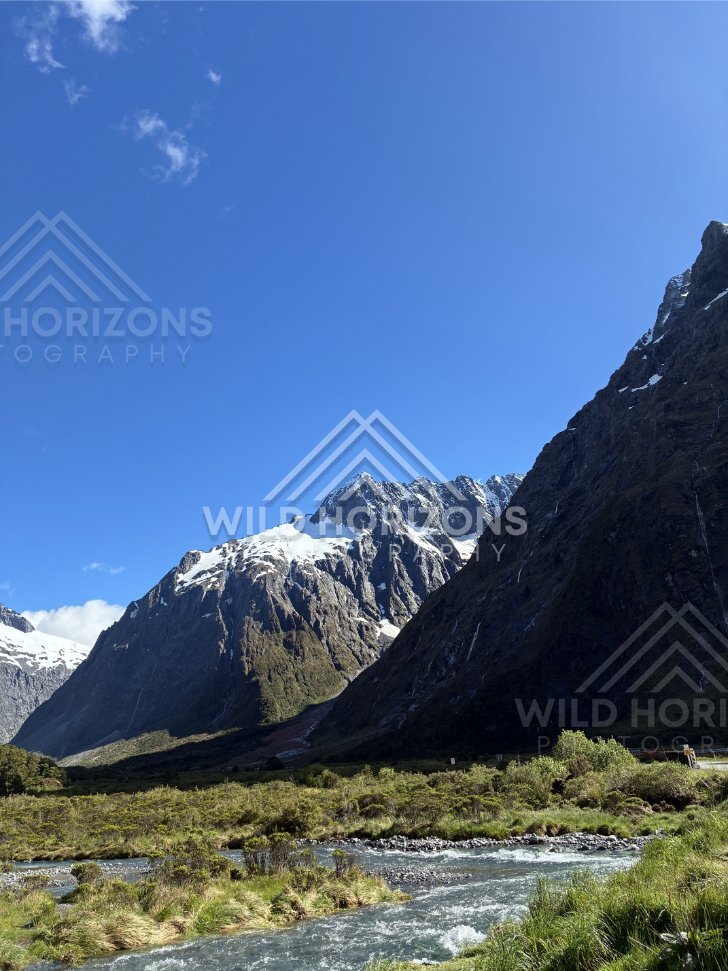 Vertical View of River and Snowy Fiordland Peaks, Milford Road, Fiordland National Park, New Zealand