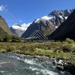 Snow-Peaked Fiordland Mountains above a Rushing River, Milford Road, Fiordland National Park, New Zealand