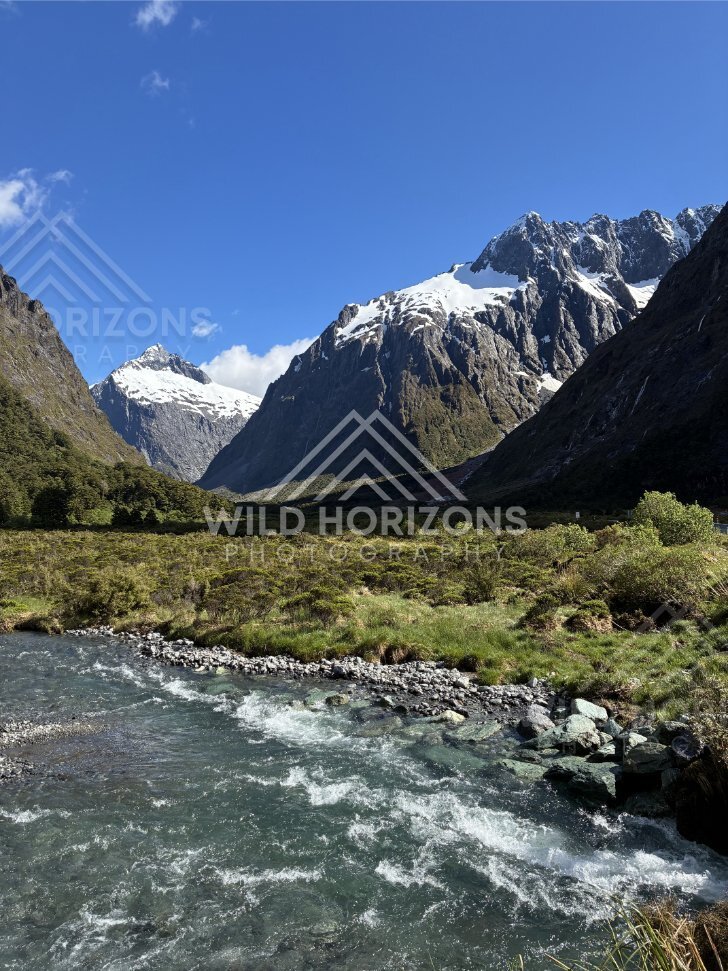 Snow-Peaked Fiordland Mountains above a Rushing River, Milford Road, Fiordland National Park, New Zealand