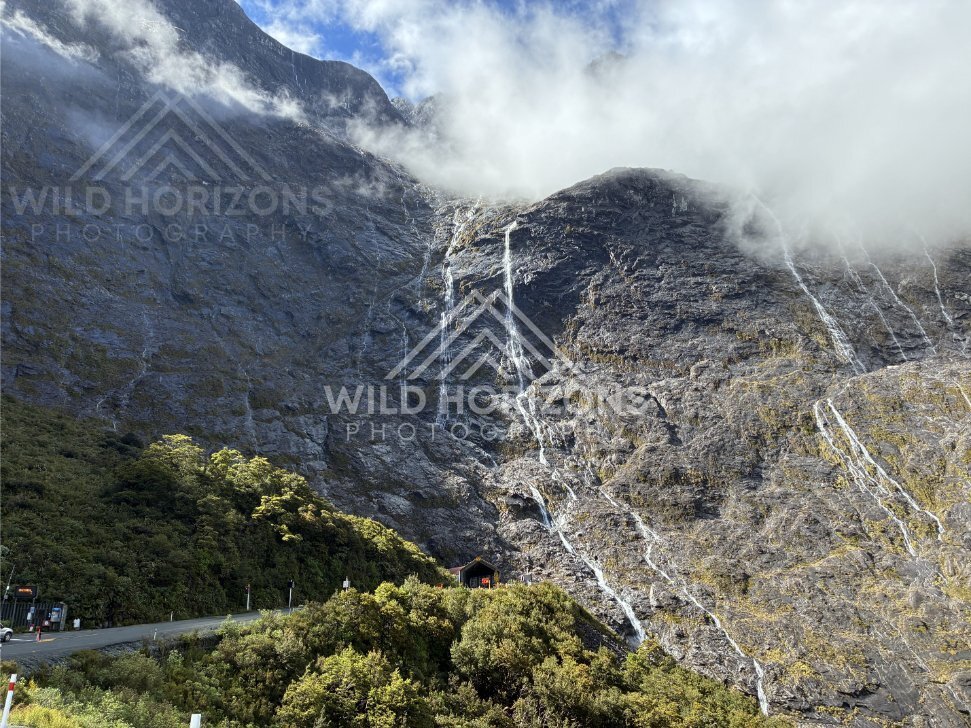 Roadside View of Post-Rain Waterfalls near the Homer Tunnel, Milford Road, Fiordland National Park, New Zealand