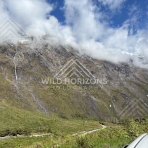 Alpine Valley with Lifting Cloud and Distant Snow Patches, Milford Road, Fiordland National Park, New Zealand
