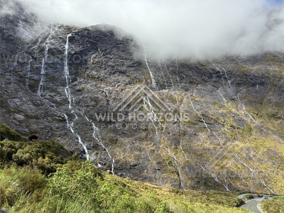 Fiordland Cliff Face with Waterfalls and a Hairpin Road Bend, Milford Road, Fiordland National Park, New Zealand
