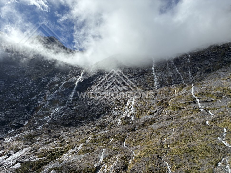 Low Cloud Rolling Over Waterfall-Streaked Mountain Slopes, Milford Road, Fiordland National Park, New Zealand