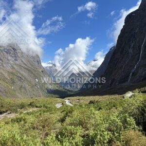 Milford Road Valley Framed by Waterfalls and Towering Cliffs, Milford Road, Fiordland National Park, New Zealand