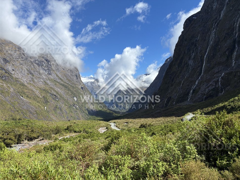 Milford Road Valley Framed by Waterfalls and Towering Cliffs, Milford Road, Fiordland National Park, New Zealand
