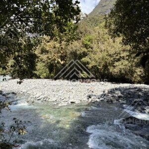 Clear River Pool and Gravel Bar in Fiordland Forest, Milford Road, New Zealand