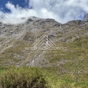 Steep Cliff Waterfall Under Breaking Cloud, Milford Road, New Zealand