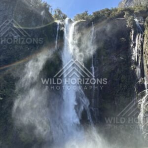 Waterfall mist with a faint rainbow, Milford Sound, New Zealand